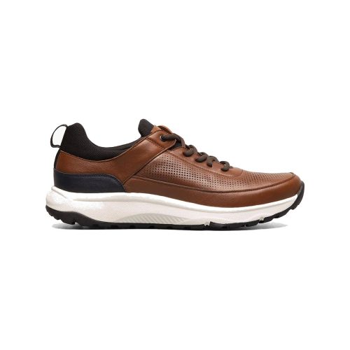 The Florsheim FLORSHEIM SATELLITE PERF ELASTIC LACE SLIP ON SNEAKER COGNAC - MENS is a brown leather sneaker with black accents, a white midsole, and a black rubber outsole. Featuring perforated sides, a pull tab on the heel, and brown laces, this shoe also boasts a Comfortech footbed for added comfort and support.