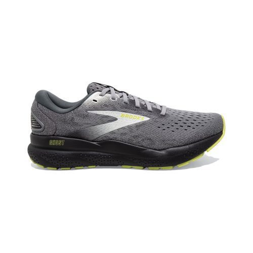 A side view of a gray Brooks BROOKS GHOST 16 PRIMER/GREY/LIME - MENS running shoe with perforated fabric, a white logo, and yellow accents on the sole and branding. The men's shoe offers superior cushioning for optimal comfort while you run.