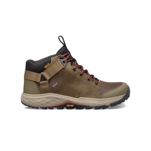 Side view of a brown and tan hiking boot with orange and black accents, featuring a high ankle, loop for easy wearing, waterproof leather, and a durable Vibram Megagrip outsole – the Teva TEVA GRANDVIEW GTX DARK OLIVE - MENS.