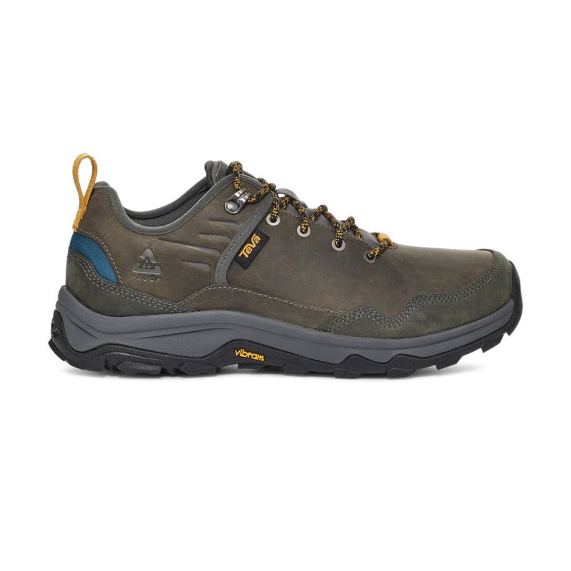 A brown hiking shoe with yellow shoelace accents, a rugged sole, and a blue detail at the heel, featuring a grippy outsole for optimal traction on trails. The TEVA RIVA RP CHARCOAL/BLUE - MENS by Teva also boasts a responsive footbed for enhanced comfort and support, shown on a white background.