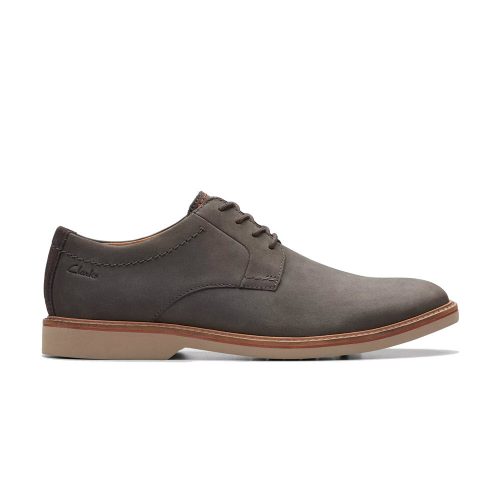 A side view of a classic profile grey nubuck dress shoe with a beige sole and lace-up design. The brand name "Clarks" is visible on the side, highlighting its use of premium fabrics for added durability and style. This is the CLARKS ATTICUS LT LACE OXFORD GREY NUBUCK - MENS.