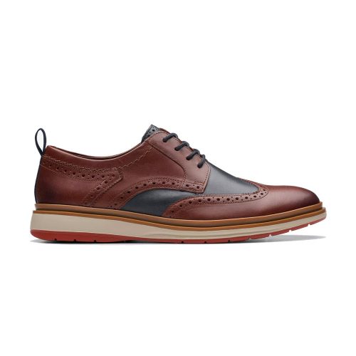 A CLARKS CHANTRY WING OXFORD BRITISH TAN COMBINATION - MENS with black detailing, brogue patterns, and a red-rubber sole, showcasing Clarks quality craftsmanship. Seen from the side.