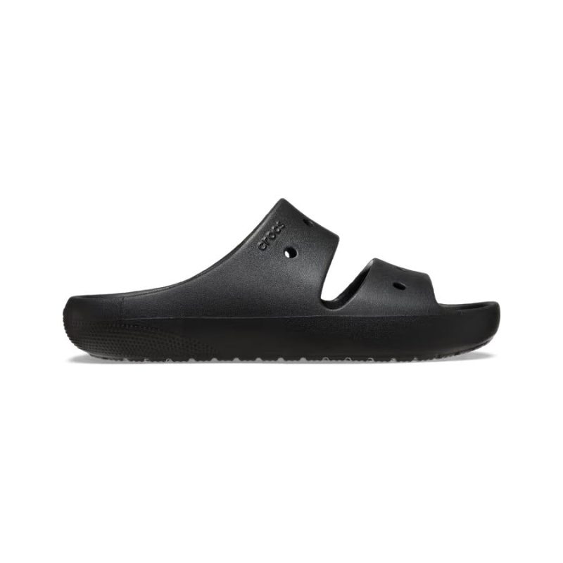 A side view of a single black rubber sandal with two straps and a textured sole, offering an Iconic Crocs Comfort for a perfect fit: the CROCS CLASSIC SANDAL V2 BLACK - MENS by Crocs.