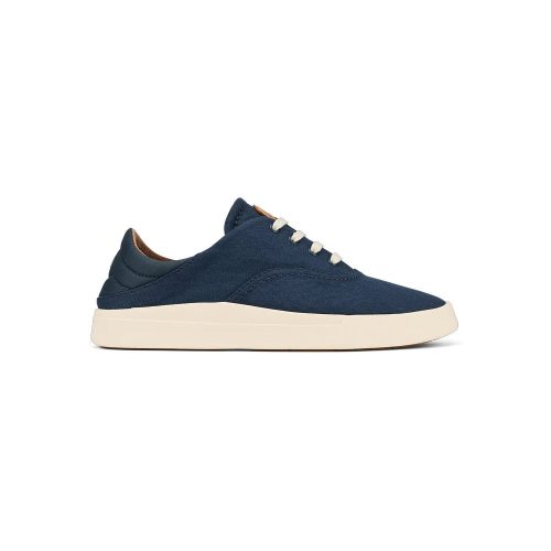 A side view of a navy blue, minimalist OLUKAI KOHU NAVY - WOMENS sneaker by Olukai with white laces and a white rubber sole, crafted from lightweight canvas.