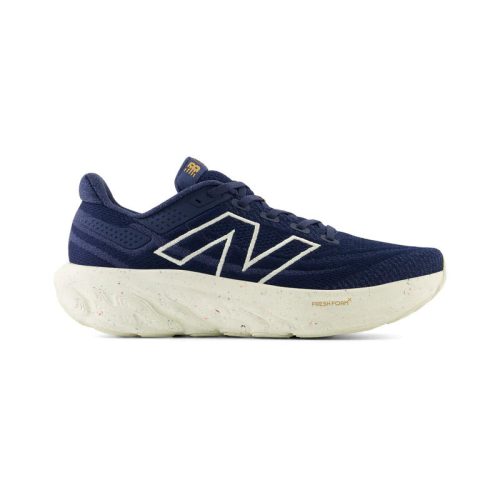 A single navy blue athletic running shoe with white accents and a thick, white, textured sole featuring a New Balance logo on the side. Enhanced with Fresh Foam X midsole cushioning for superior comfort - the NEW BALANCE 1080V13 NAVY/VINTAGE INDIGO/SEA SALT - MENS from New Balance.