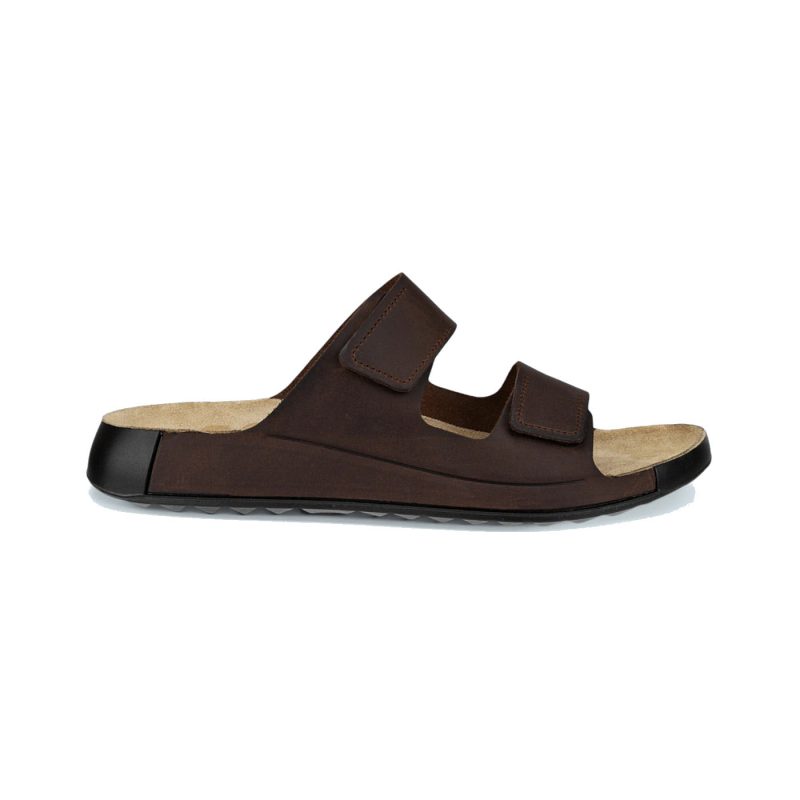 The ECCO 2ND COZMO M TWO BAND SLIDE POTTING SOIL - MENS, a brown slip-on sandal crafted from premium leather, features two adjustable straps and a padded footbed for superior comfort, shown in a side view.