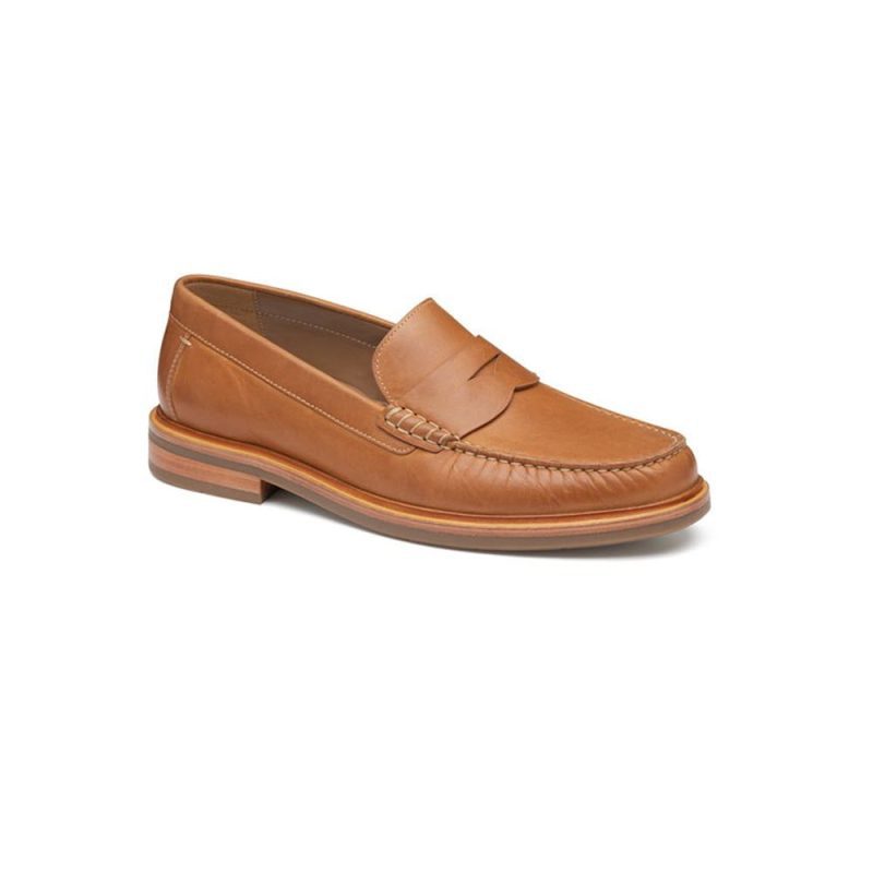 A Johnston & Murphy JOHNSTON & MURPHY LYLES SLIP ON PENNY TAN FULL GRAIN - MENS with moc toe stitching details and a small heel, displayed against a white background.