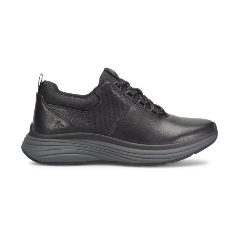 A black, low-top athletic shoe with a thick, cushioned sole and lace-up closure, designed for support and comfort. It features an orthotic insole for enhanced foot support and slip-resistant properties. Introducing the ALIGN TAHOE FULL GRAIN LEATHER SLIP RESISTANT OXFORD BLACK - MENS by Align.