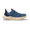 The HOKA ANACAPA 2 FREEDOM FOGGY NIGHT/OAT MILK - MENS by Hoka is a blue athletic shoe with beige soles, featuring mesh fabric panels and orange accents, designed with HOKA geometry.