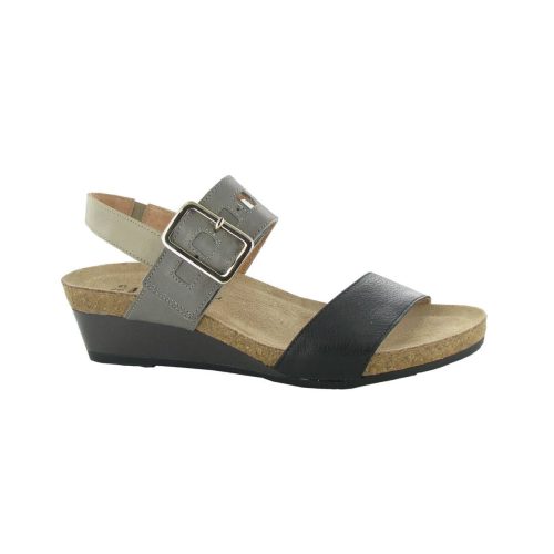 The Naot NAOT DYNASTY DYNASTY BLACK FOG - WOMENS is a wedge sandal featuring a cork sole, and two straps: a black front strap and a gray ankle strap with a buckle. The heel height is moderate, designed with an anatomic footbed for superior comfort.