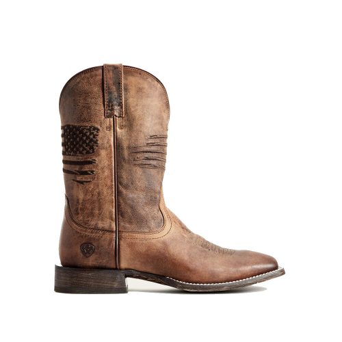 A single brown distressed leather cowboy boot with an American flag design on the side, a thick heel, and white stitching around the sole, featuring a durable Goodyear welt. This is the ARIAT CIRCUIT PATRIOT 11 INCH WESTERN SQUARED TOE BOOT WEATHERED TAN - MENS by Ariat.