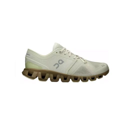 A side view of the ON CLOUD X ALOE/HUNTER - WOMENS by On Running, a light green athletic shoe with a unique segmented sole design and laces. Known for its versatility, the shoe features a small circular logo on the side and promises to be both light and responsive for any activity.