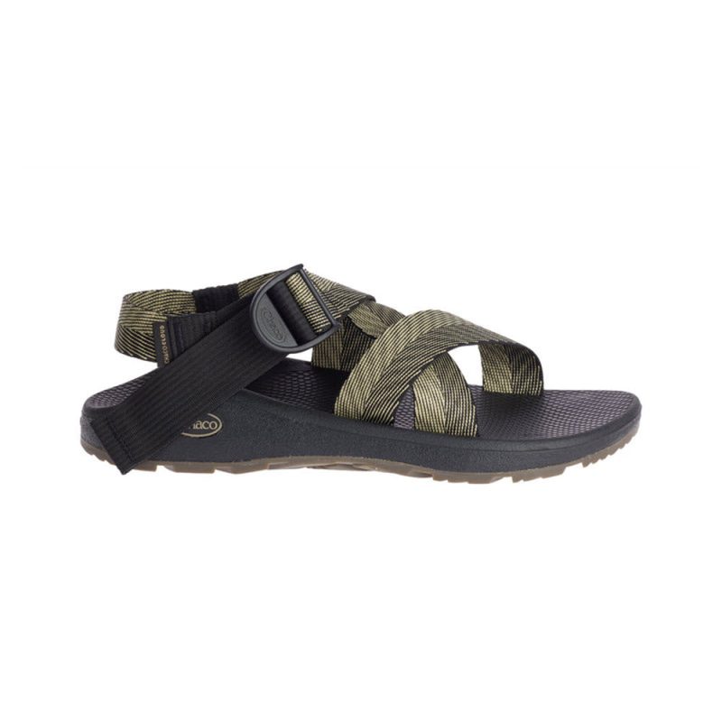 A single black and olive green Chaco CHACO MEGA Z CLOUD SANDAL ODDS BLACK - MENS sandal with adjustable straps and a textured sole, designed for hiking, viewed from the side.